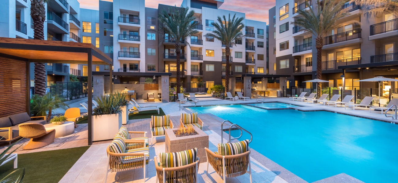 Swimming Pool Spacious sparkling swimming pool with a large pool deck and cabanas for lounging