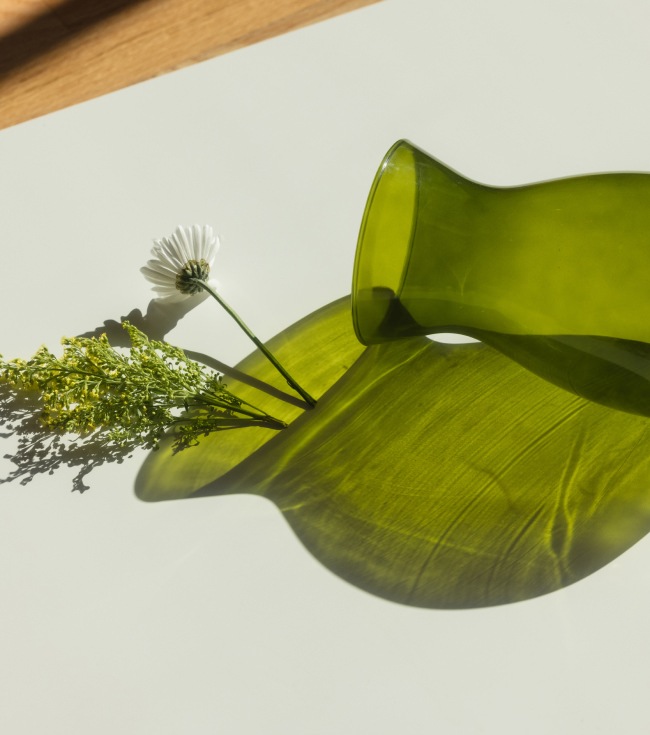 Green vase on a table 